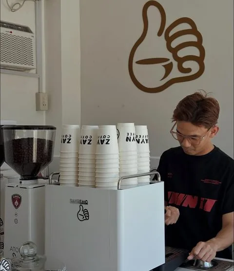 Barista preparing coffee at Zayn Coffee