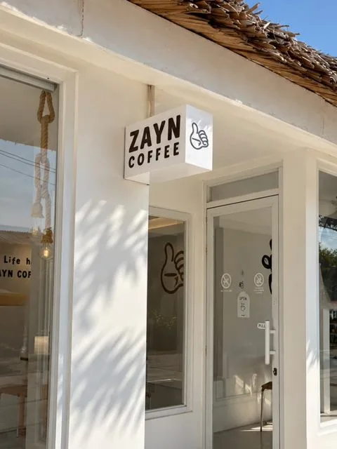 Zayn Coffee storefront in Hilongos, Leyte, with its thatched roof and ZAYN COFFEE sign above the entrance